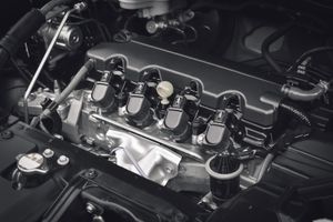 Close-up of a car engine with shiny black components and chrome details