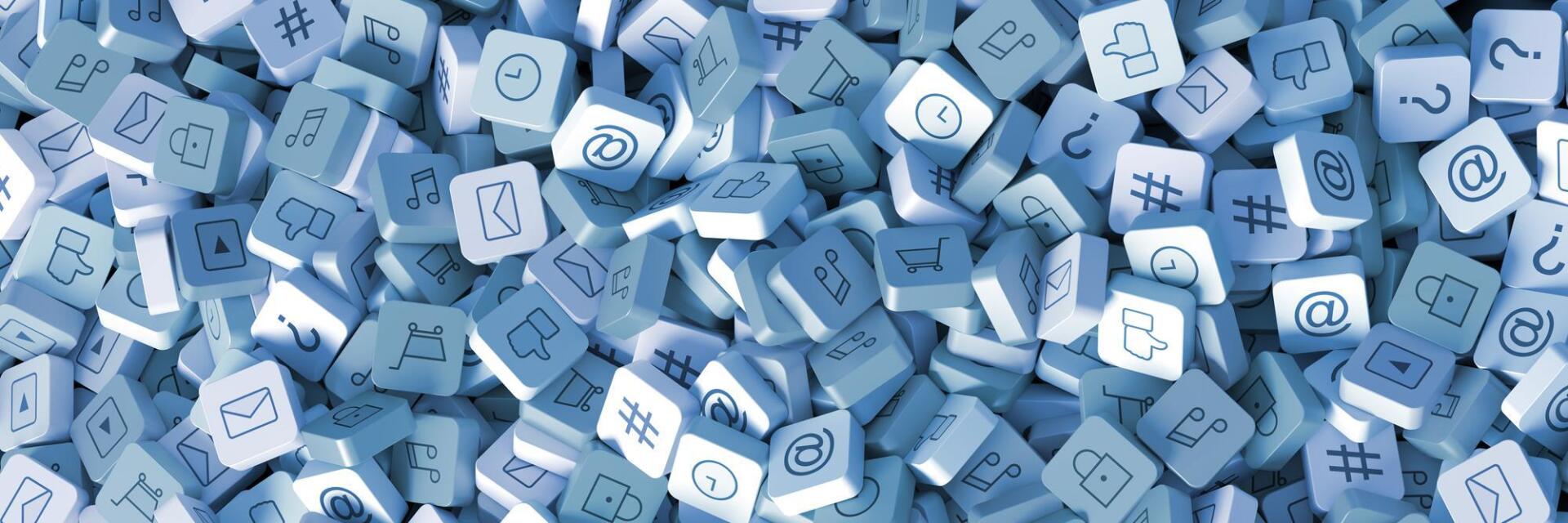 A pile of blue and white blocks with letters and numbers on them