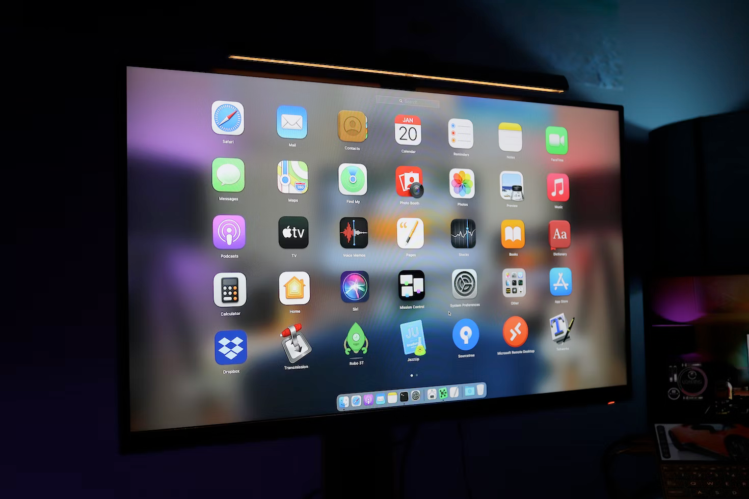 A computer monitor with a bunch of apps on it