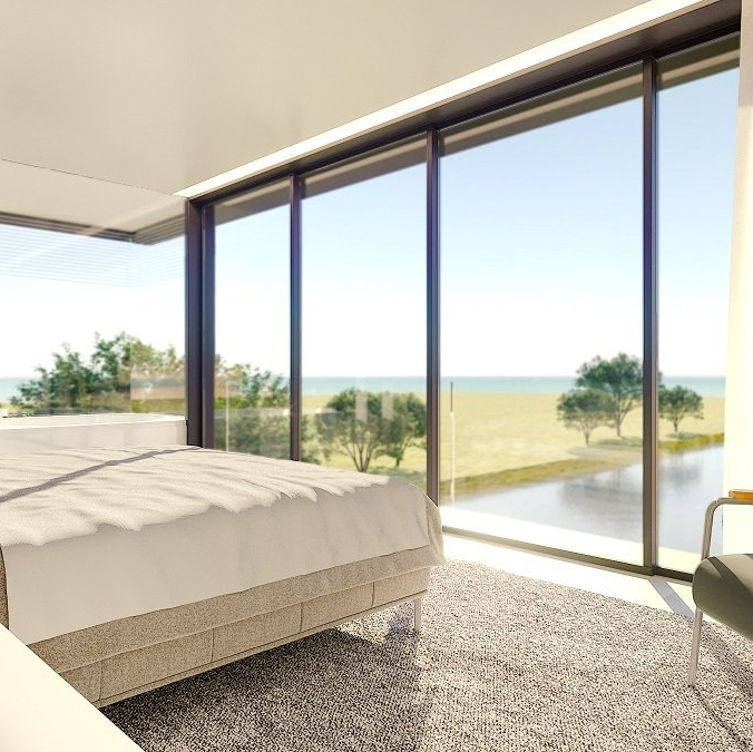 Um quarto com uma cama grande e muitas janelas