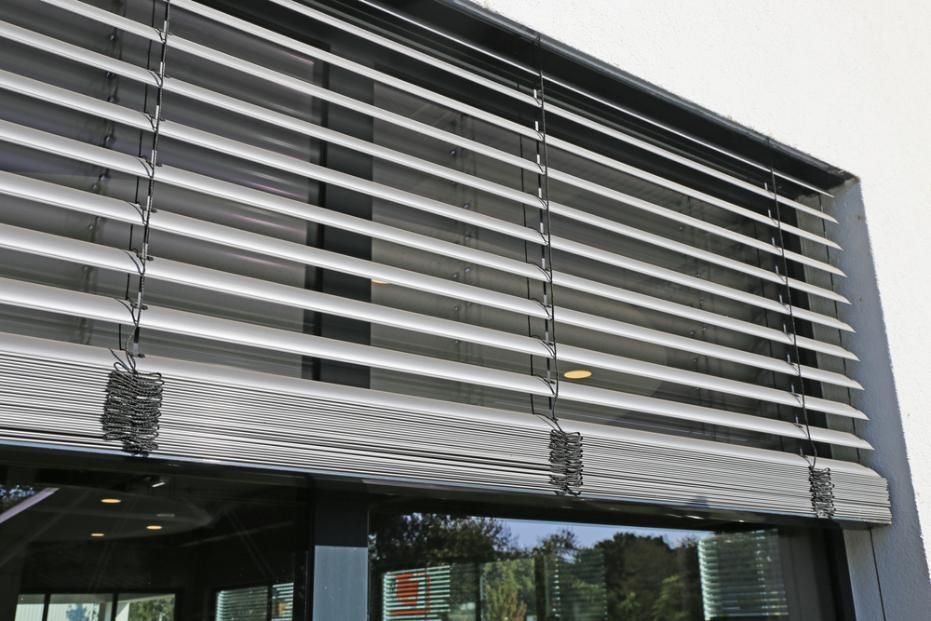A Building With A Windows And A Blinds On It — Outdoor Blinds In Wyong, NSW