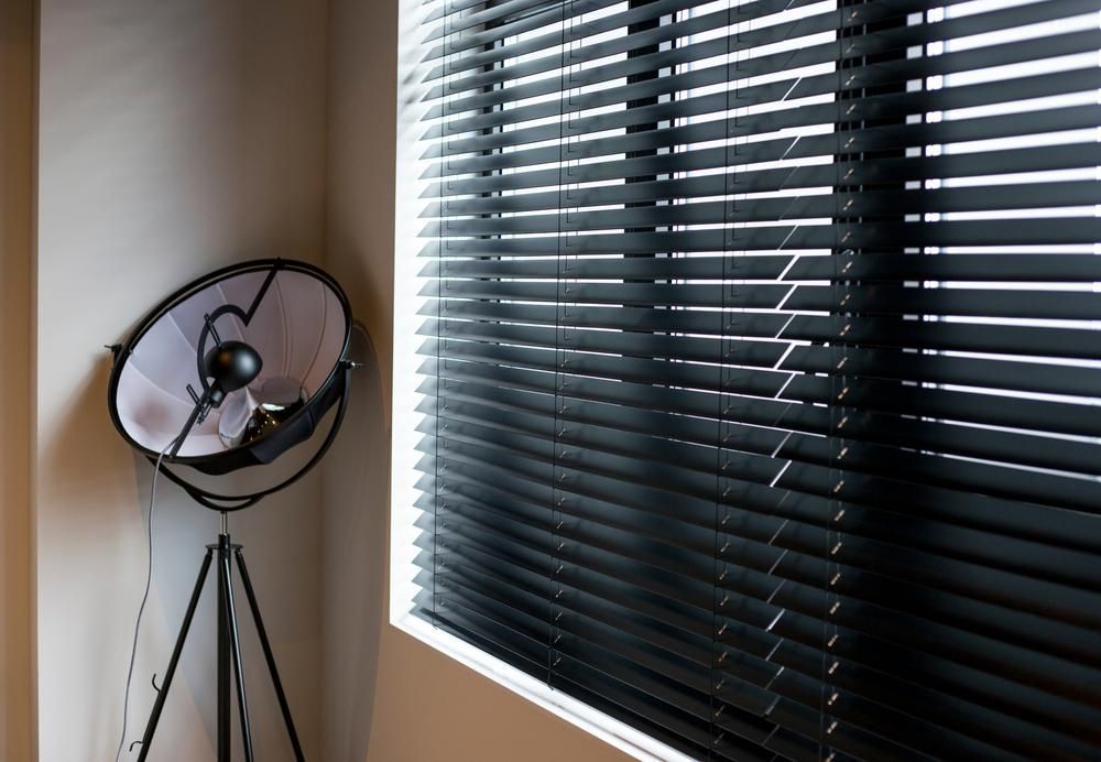 A Window With Black Blinds — Outdoor Blinds In Wyong, NSW