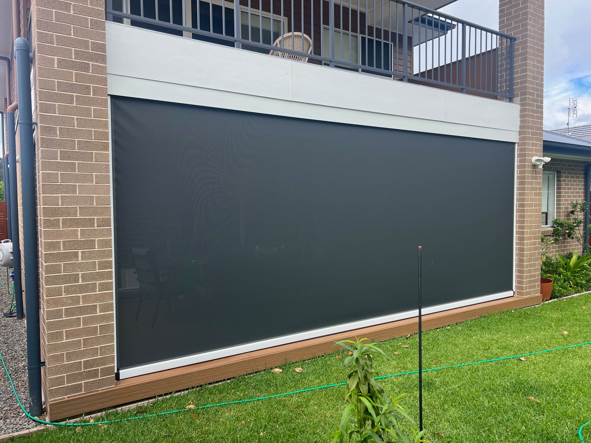 A View Of A House Through A Screen Door — Outdoor Blinds In Berkeley Vale, NSW