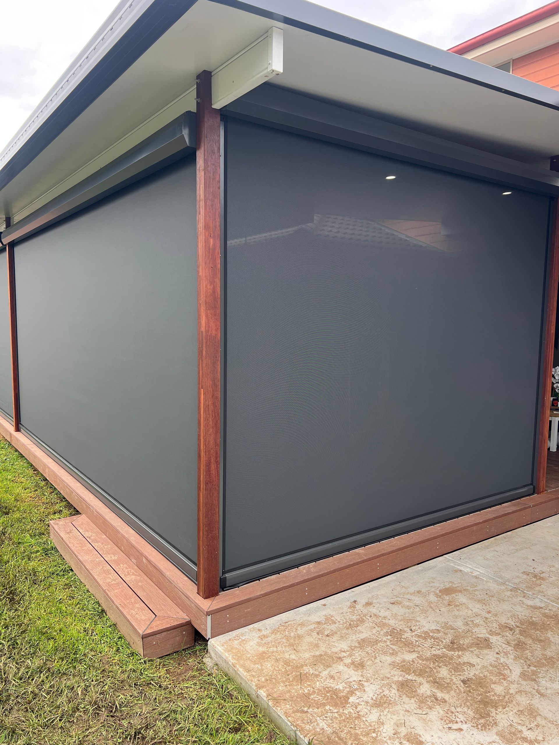 A Patio With A Couch, Chairs, And A Table — Outdoor Blinds In Berkeley Vale, NSW