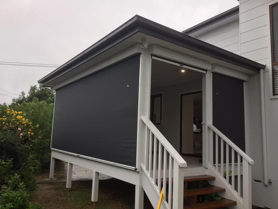 A House With Stairs Leading Up To A Porch With Blinds On It — Outdoor Blinds In Berkeley Vale, NSW