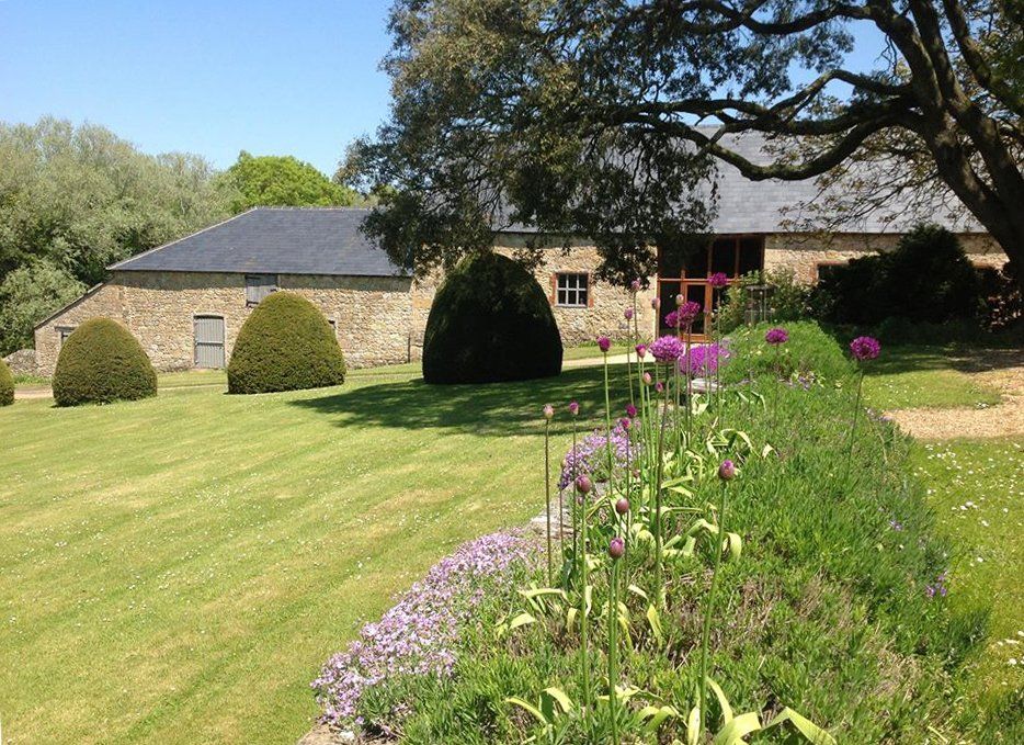 Formal gardens outside the wedding barn at New Barn Farm, Calbourne, Isle of Wight