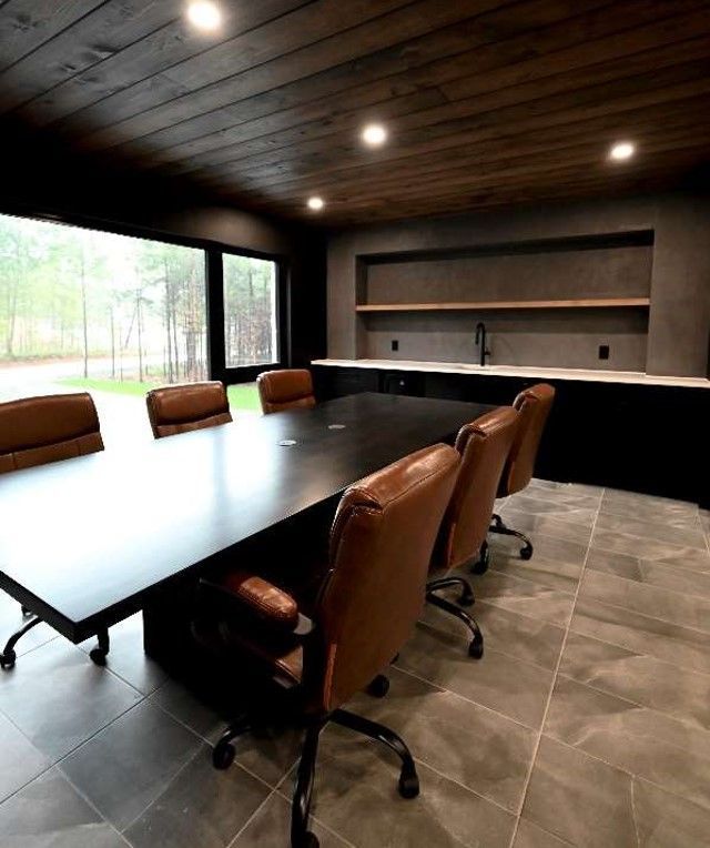 A conference room with a long table and chairs