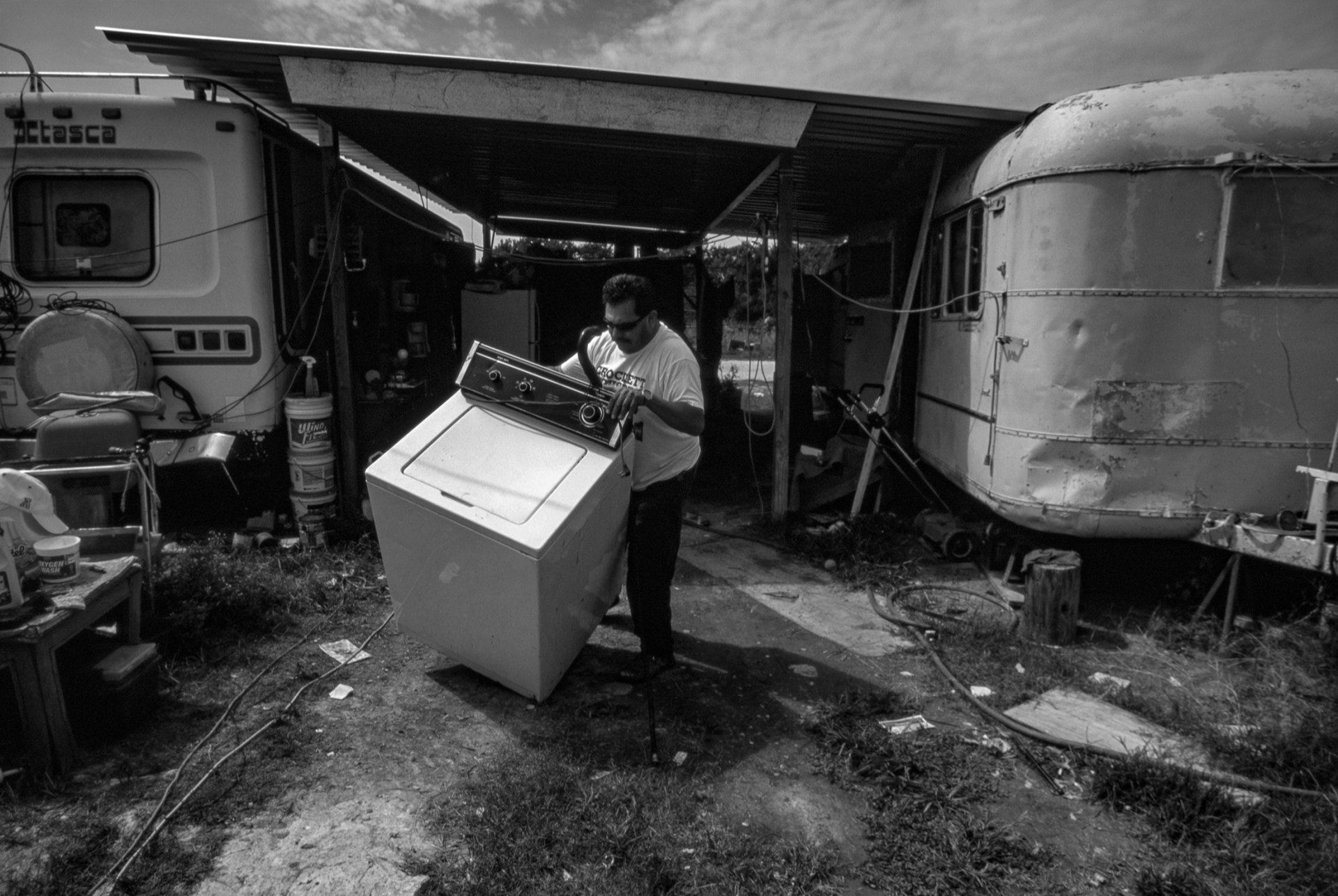 Ismael begins packing up the family's belongings.