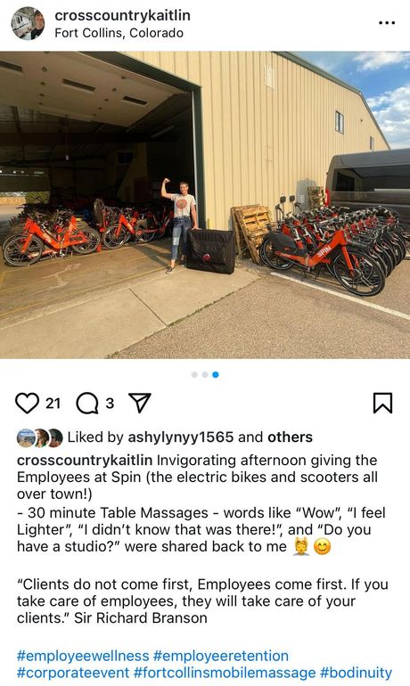 A man is standing in front of a row of bikes in a garage.