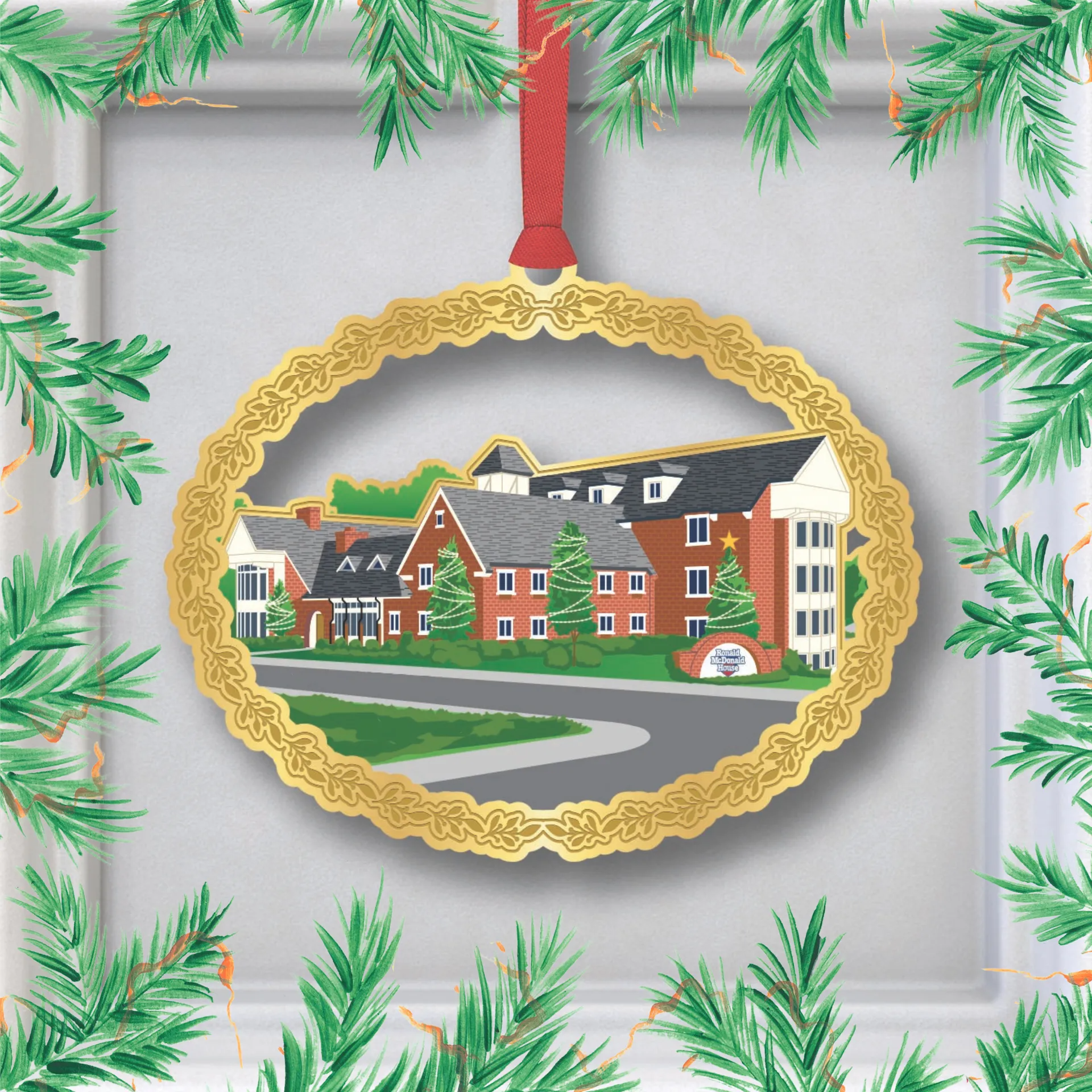 Gold ornament with red ribbon framing a painting of a brick building and road, bordered by pine branches