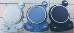 Three blue-toned disc-shaped devices, light to dark blue, with white accents and control buttons.