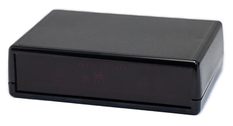 Black rectangular electronic device with a red display.