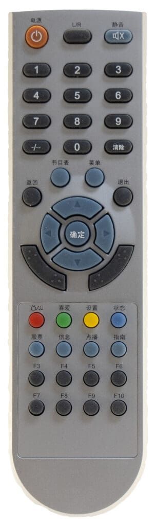 A gray remote control with multiple black and blue buttons, angled downward.