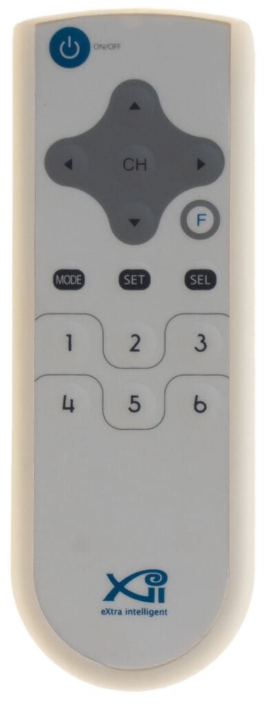 White remote control with buttons for power, channel, volume, and numbers.