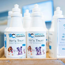 Bottles of Artistic Cleaners Vet's Trust odor eliminator featuring illustrations of dogs and cats on a retail shelf.
