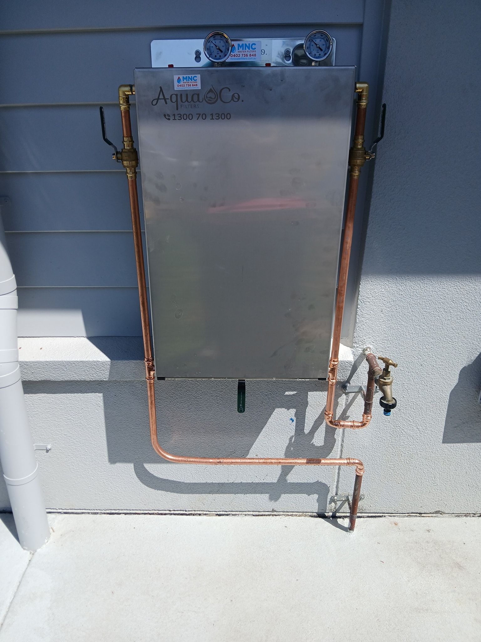 A Stainless Steel AquaCo Water Filtration Unit — APD Plumbing In Coffs Harbour, NSW