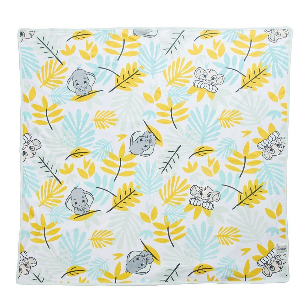 Witte deken met een patroon van gele en blauwe bladeren, grijze koala's en witte bloemen.