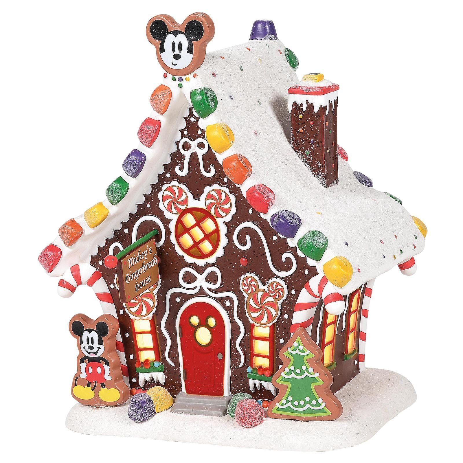 Peperkoekhuisje met Mickey Mouse-versieringen en sneeuw.