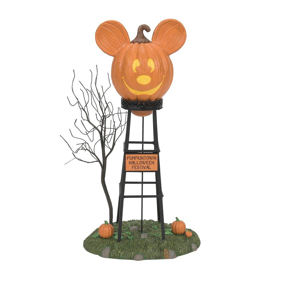 Mickey Mouse-pompoen op een toren. Oranje pompoen met een lachend gezicht, zwarte toren en pompoenen.