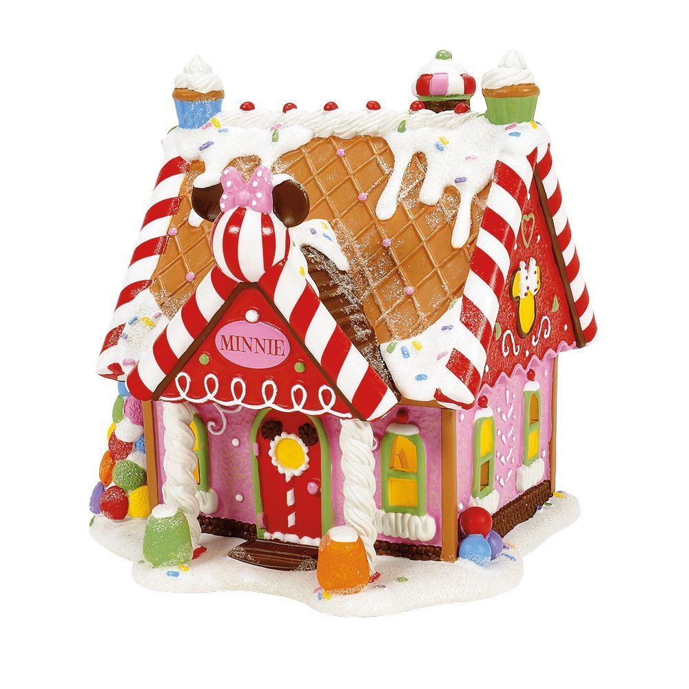 Peperkoekhuisje versierd met snoep, sneeuw en een Minnie Mouse-afbeelding.