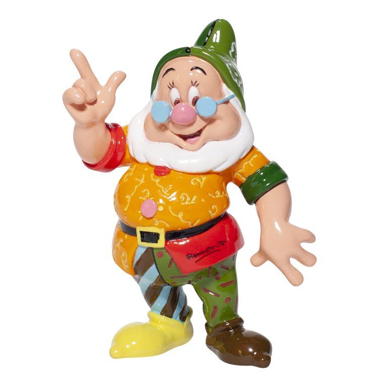 Een sullig figuurtje, met een groene hoed op en een rommelig stel kleren aan, wijst omhoog en lacht.