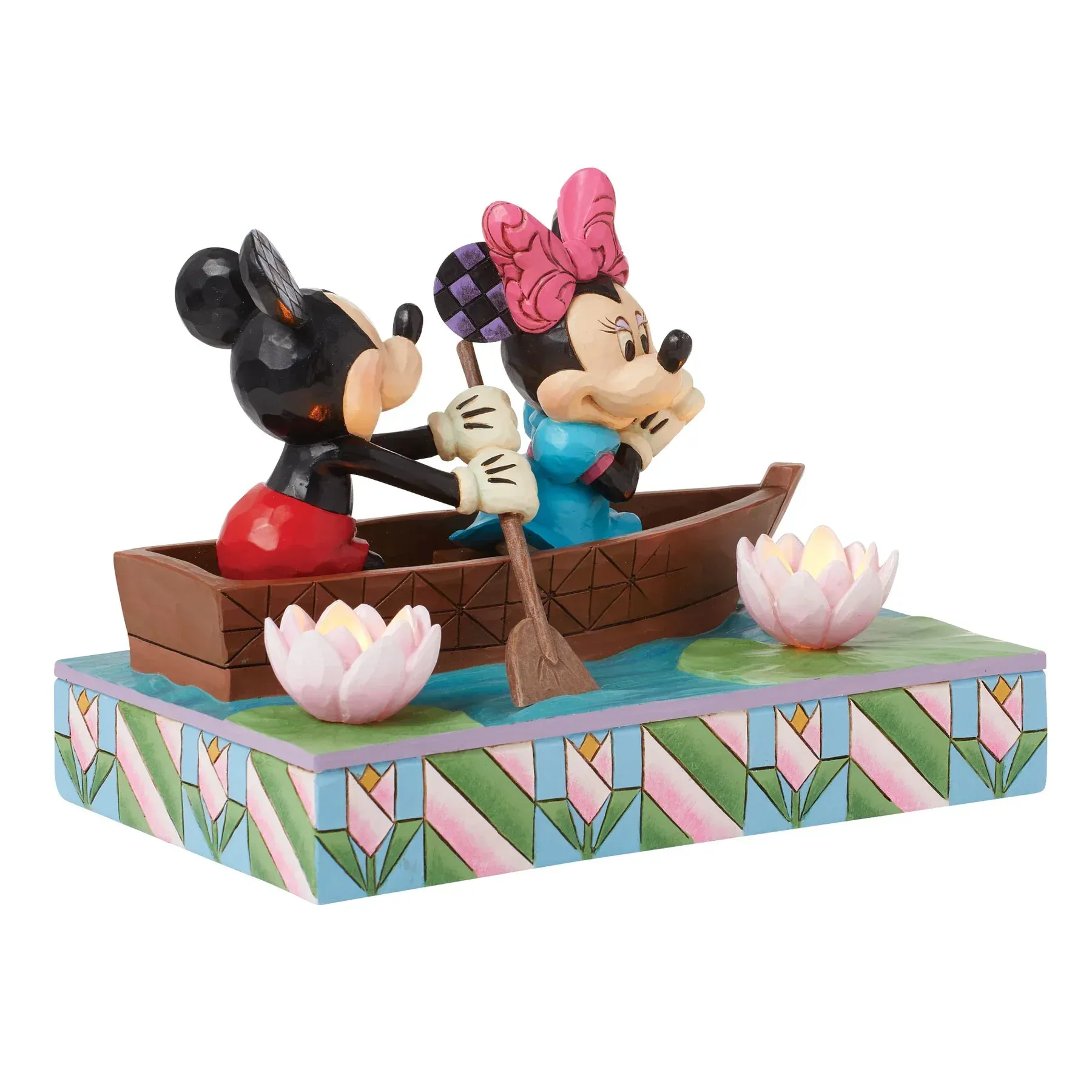 Mickey en Minnie Mouse in een boot, met een kleurrijke bloemenbasis.