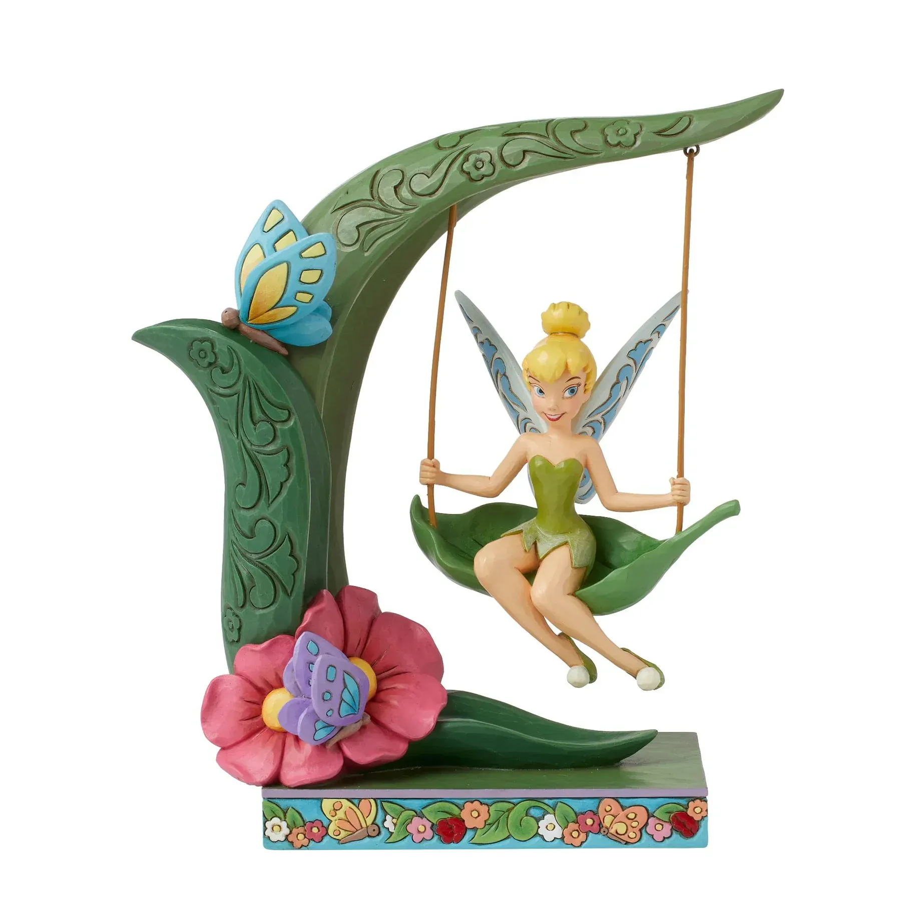 Tinkerbell op een bladschommel, blauwe vlinder, roze bloem, groene bladerboog, fantasievol beeldje.
