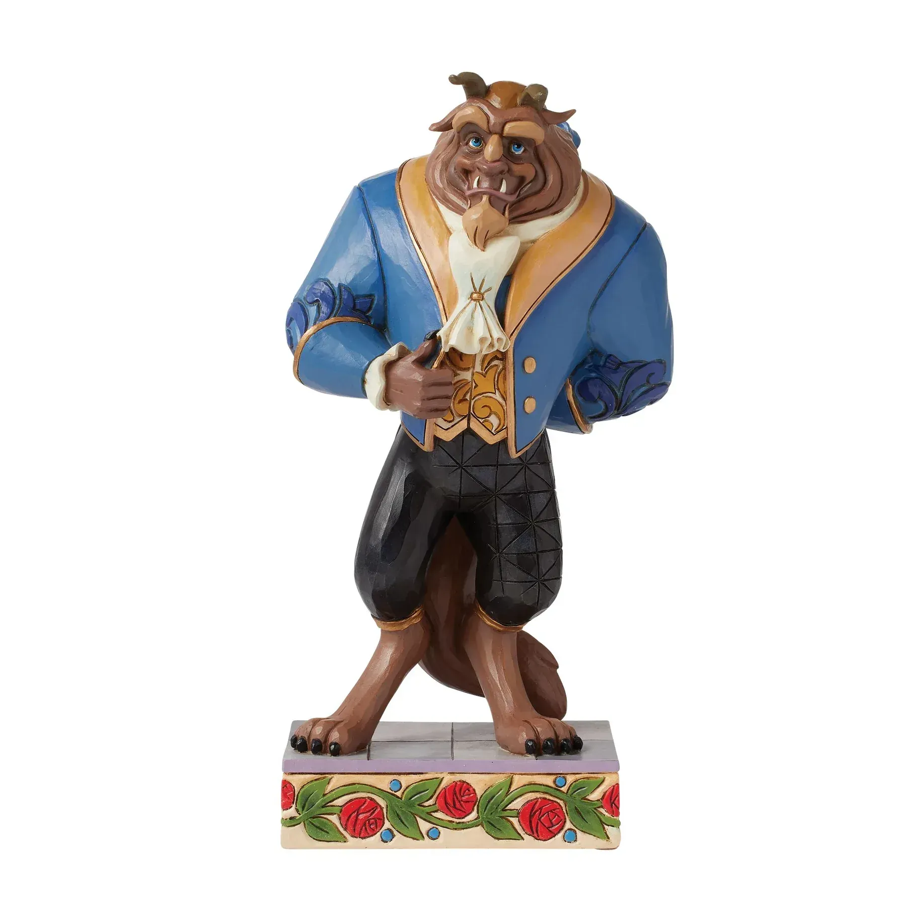 Het Beest uit Belle en het Beest, gekleed in een blauwe jas en zwarte broek, en staand op een sokkel met bloemenmotief.