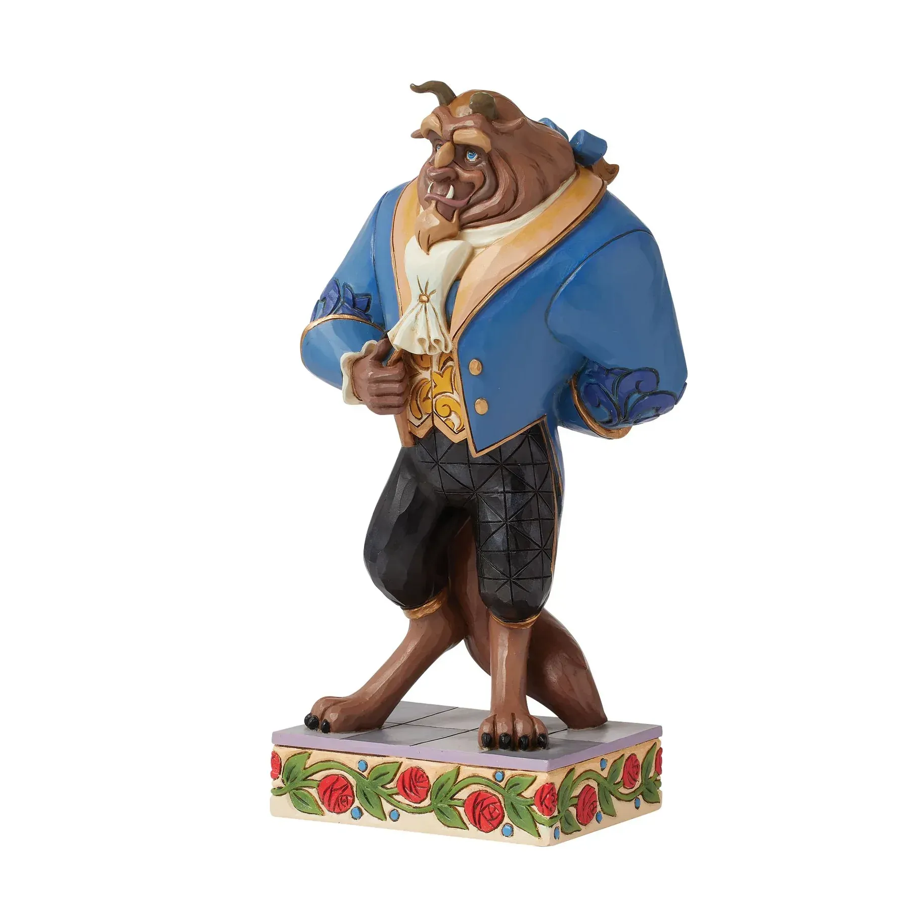 Het Beest uit Belle en het Beest, gekleed in een blauwe jas en zwarte broek, en staand op een sokkel met bloemenmotief.