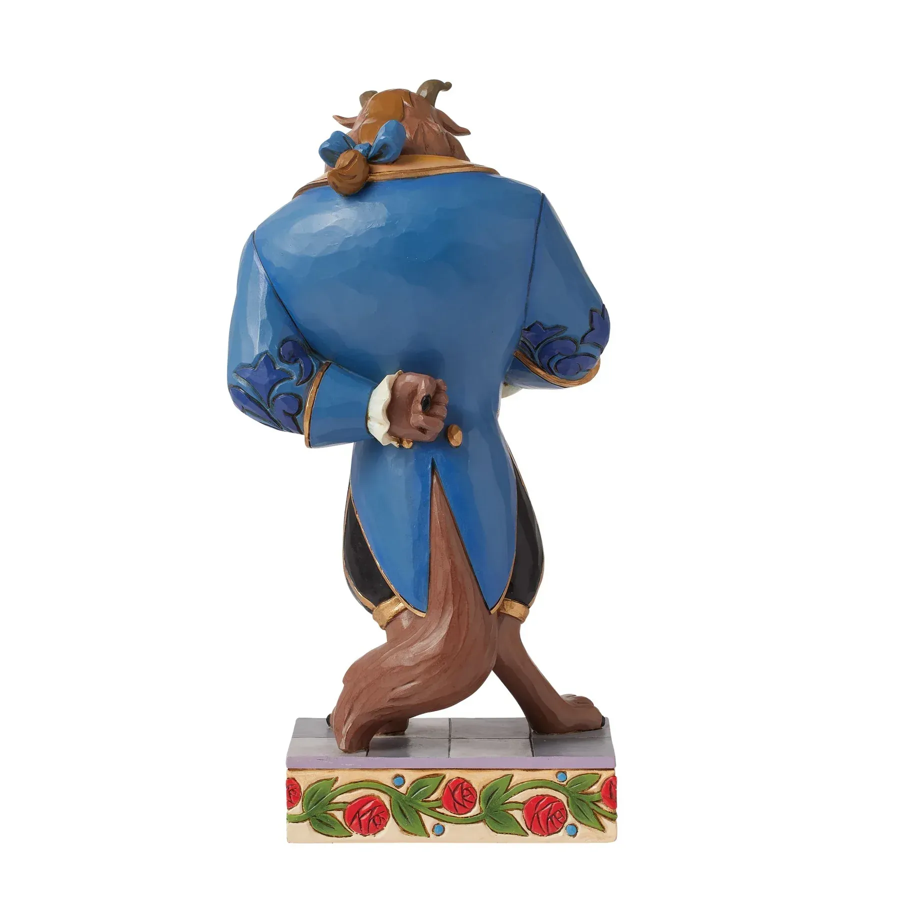 Beeldje van het Beest uit Belle en het Beest, met een blauwe jas en bruine vacht. Hij staat op een voetstuk met een bloemmotief.