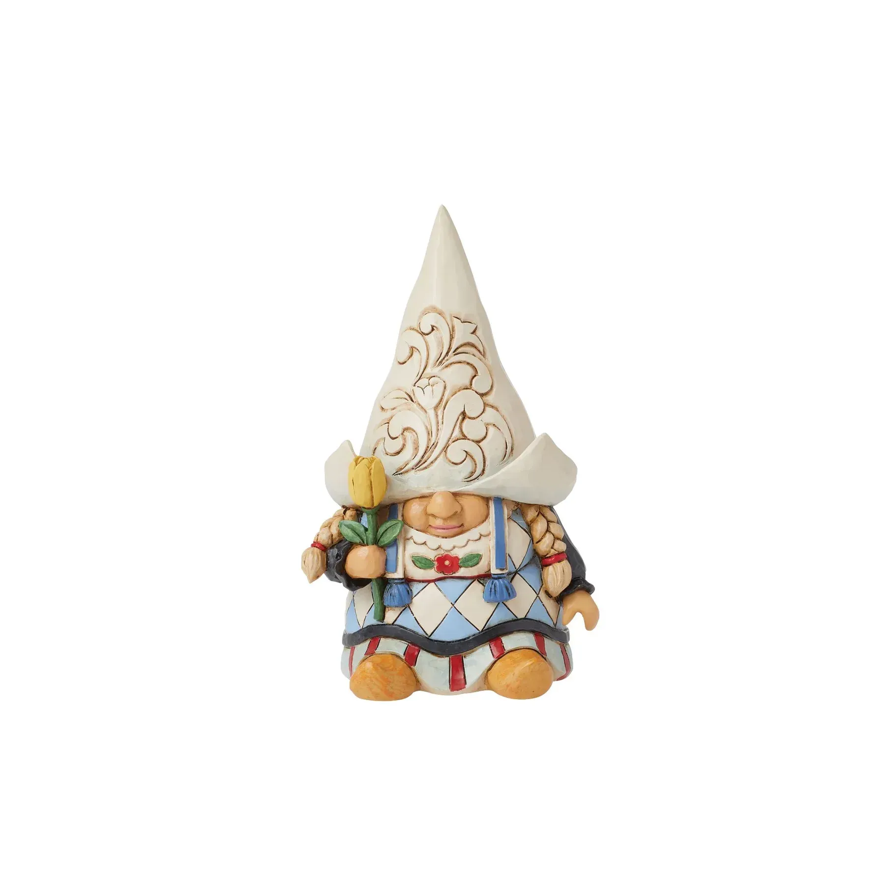 Een kabouterfiguurtje met een witte hoed en overall, die een gele bloem vasthoudt.
