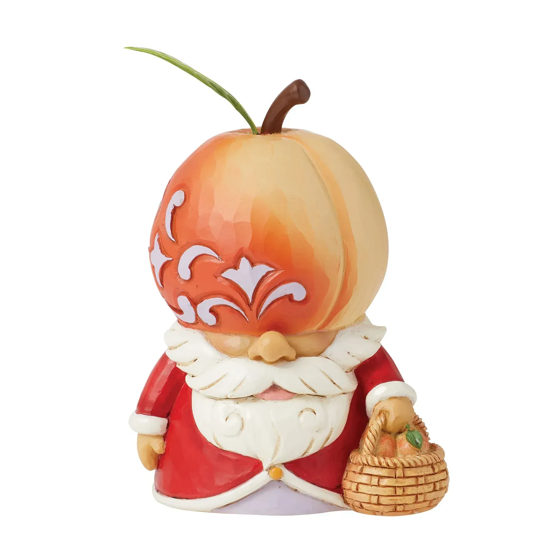 Een kerstmanfiguur met een appelvormig hoofd, die een mand met sinaasappels vasthoudt.