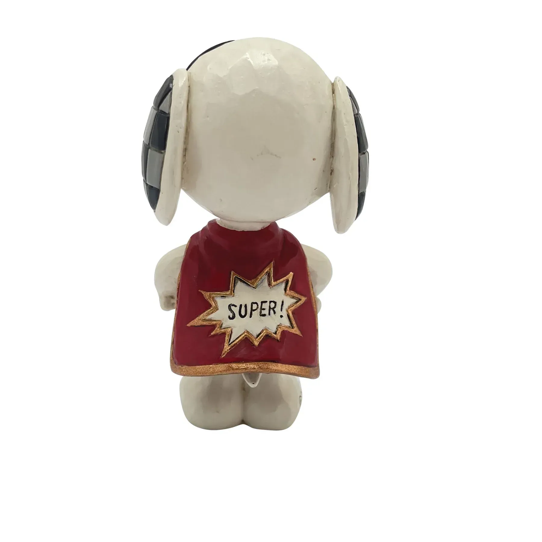 Snoopy-figuurtje met een rode cape waarop 