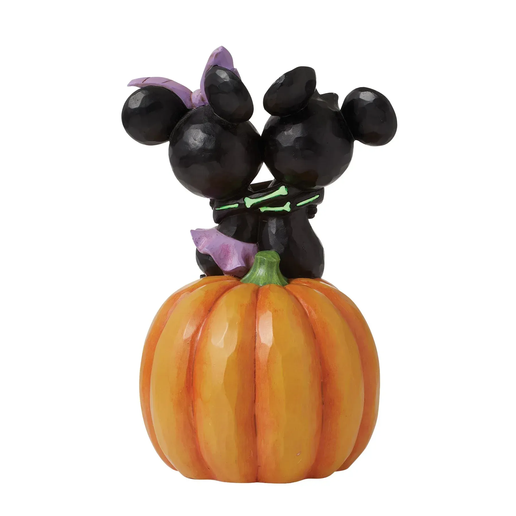 Mickey en Minnie Mouse Halloween-figuurtjes op een oranje pompoen.