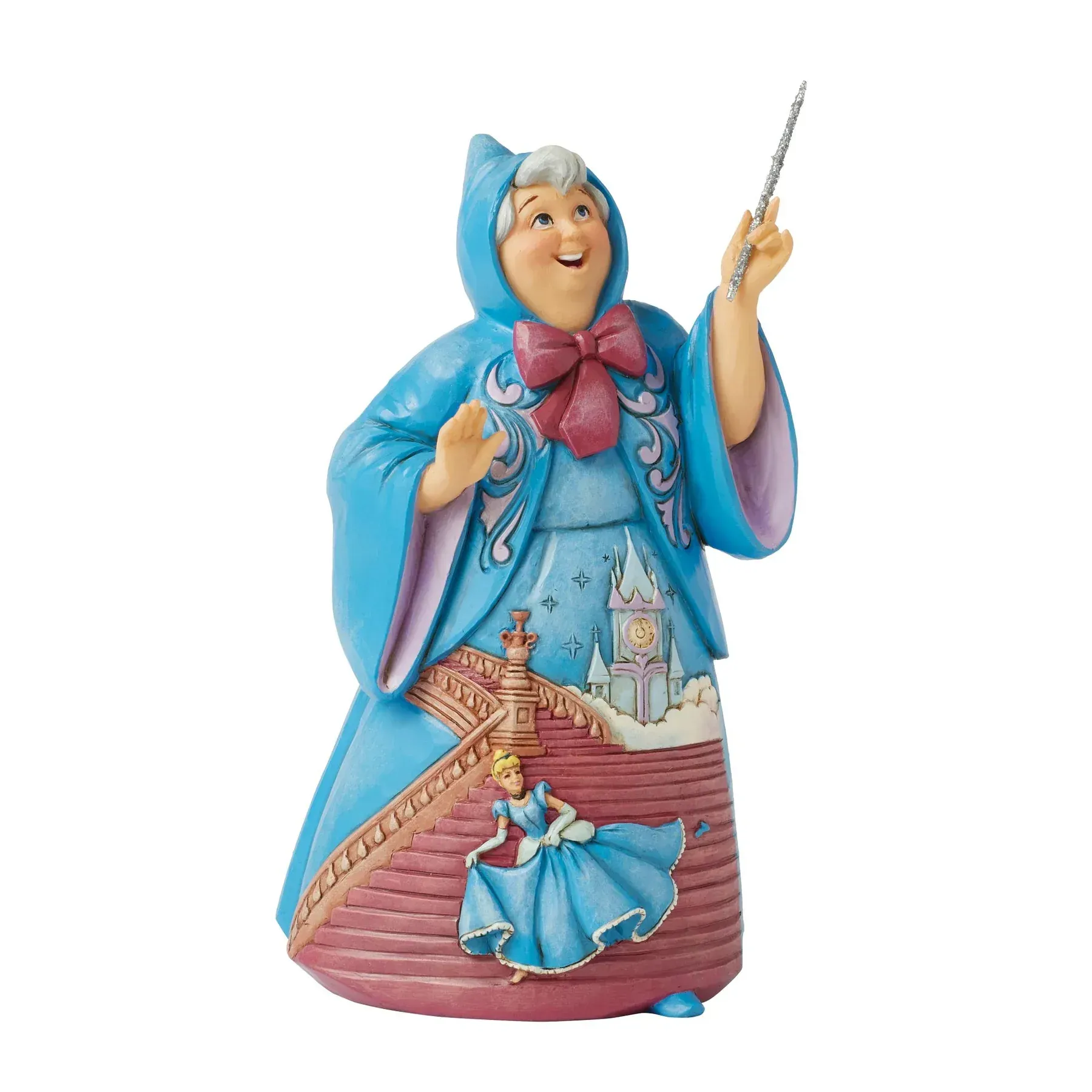 Beeldje van de goede fee, met Assepoester-thema. Blauwe mantel, roze strik, toverstaf in de hand, lachend. Assepoester op de rok.