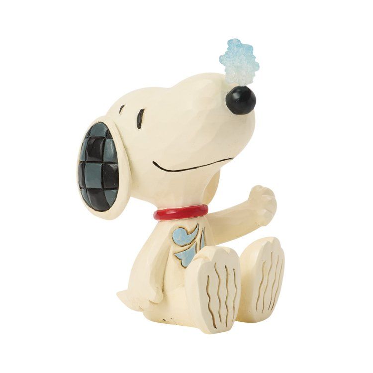 Een Snoopy-figuurtje met een rode halsband, zittend en één poot omhoog houdend; met een blauwe wolk op zijn hoofd.