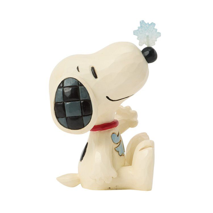 Snoopy-figuurtje, zittend, met een rode halsband, blauwe muzieknootaccenten en een blauwe kuif.