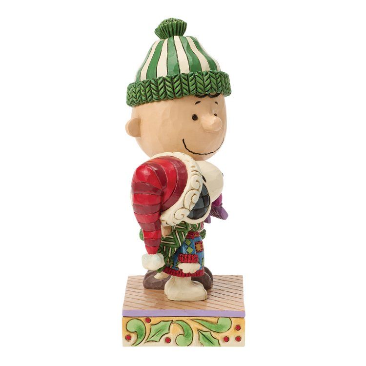Charlie Brown-figuurtje in een groen-rood feesttenue.