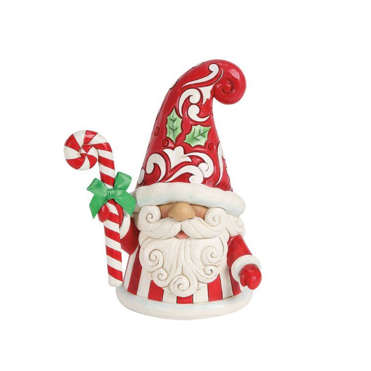 Kerstkabouterfiguurtje met zuurstok, rode en witte strepen, en een groene strik.