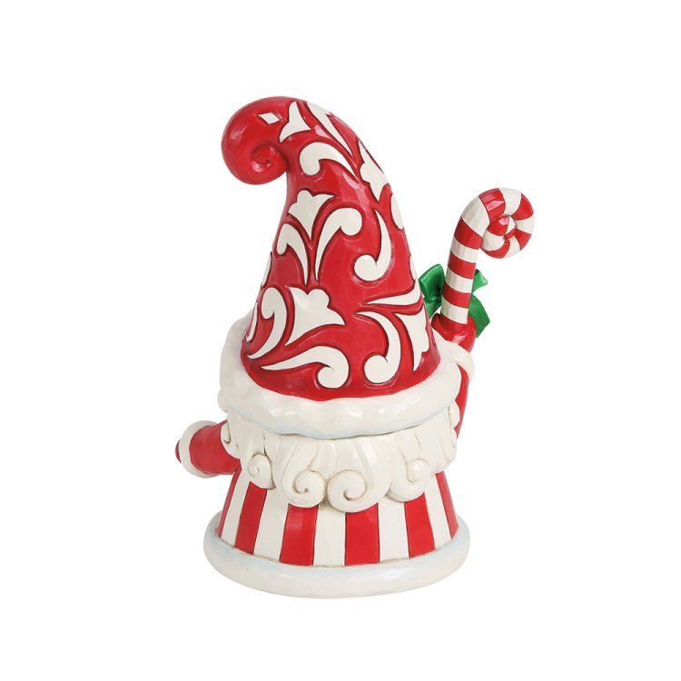 Rood-wit gestreepte kerstmanvormige verpakking met een zuurstokversiering.