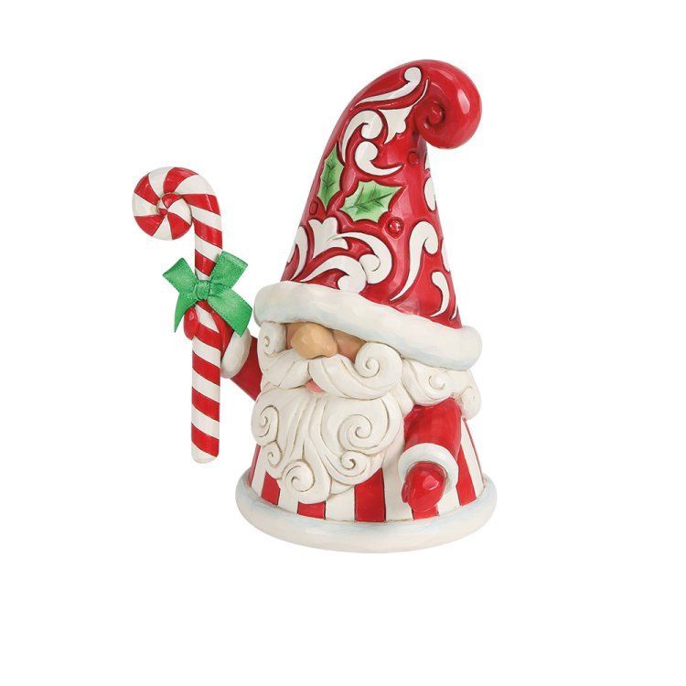 Kerstkabouterfiguurtje met zuurstok, rode en witte strepen, en een groene strik.