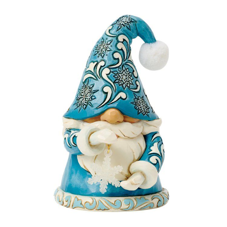 Een blauw kabouterfiguurtje dat een sneeuwvlok vasthoudt, een hoed en jas met sneeuwvlokversiering draagt ​​en een witte baard heeft.