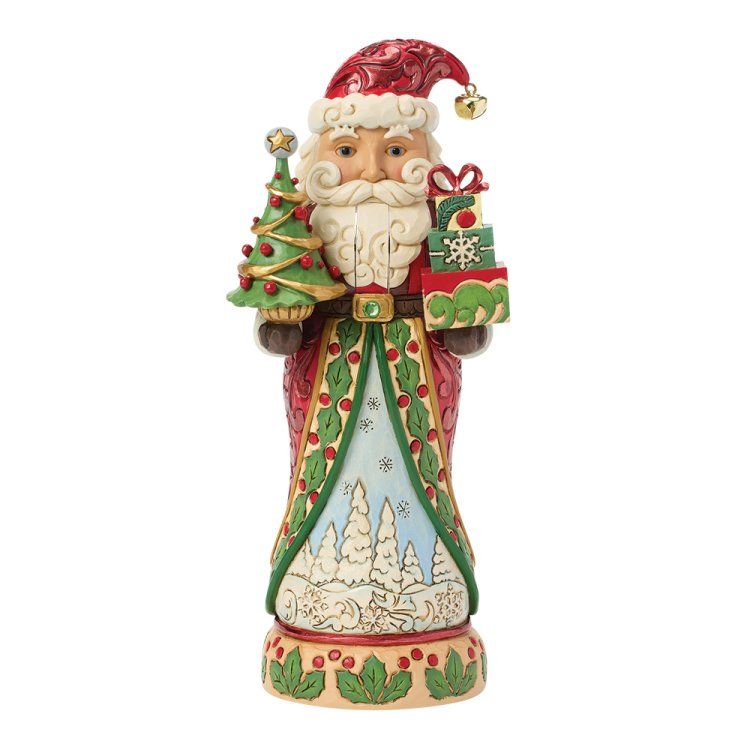 Een kerstmanfiguur met cadeautjes en een kerstboom, gekleed in een rode jas met groene rand, op een besneeuwde achtergrond.