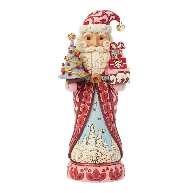 Een kerstmanfiguur met cadeautjes en een versierde kerstboom. In rode en crèmekleuren.