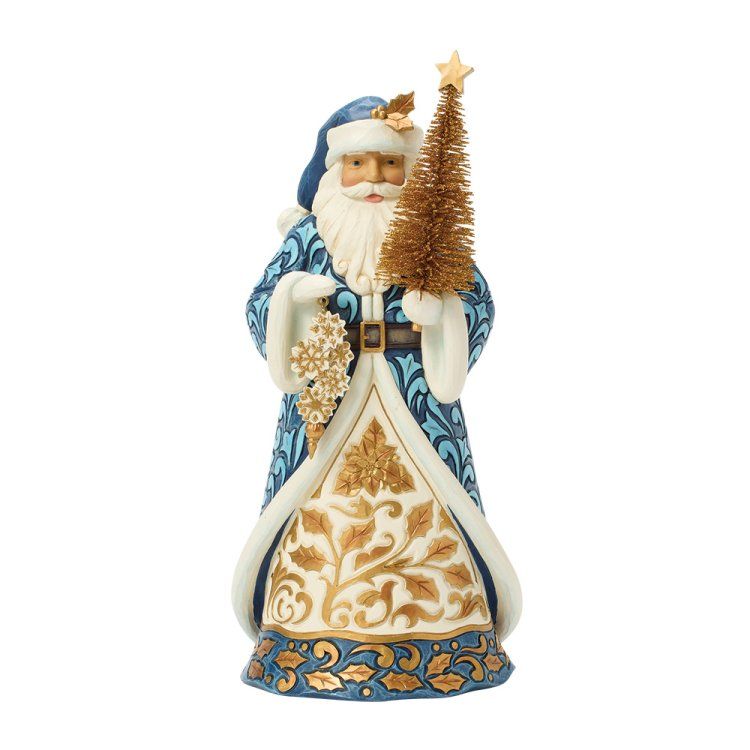 Een kerstmanfiguur met een blauw-gouden gewaad, die een kerstboom en een sneeuwvlok vasthoudt.