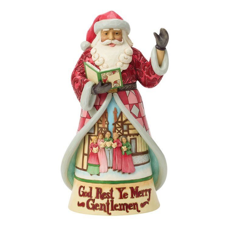 Een kerstmanfiguur met een liedboek in zijn hand, zingend. Een rode jas boven een tafereel van kerstzangers, met op de sokkel de tekst 