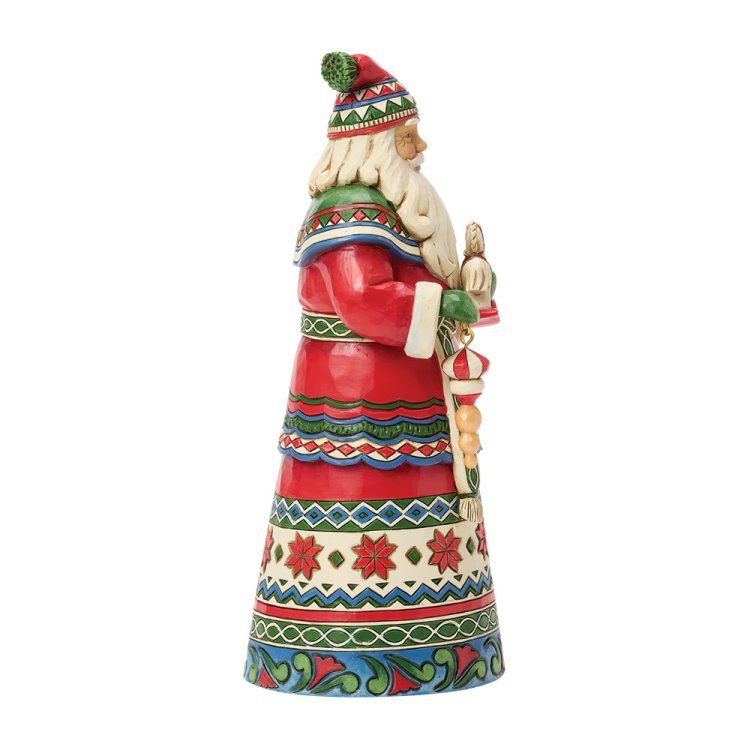 Figuur van de Kerstman in een rood-groen patroonjas, met een zuurstok in zijn hand, zijaanzicht.