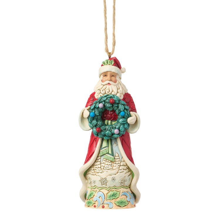 Kerstornament van de Kerstman met krans, rood pak, witte baard, beige achtergrond.