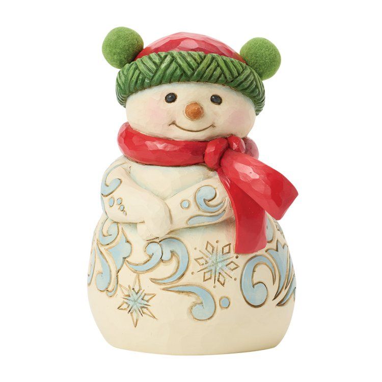 Sneeuwpopfiguurtje met rode muts en sjaal, en een blauw patroon op zijn lichaam.