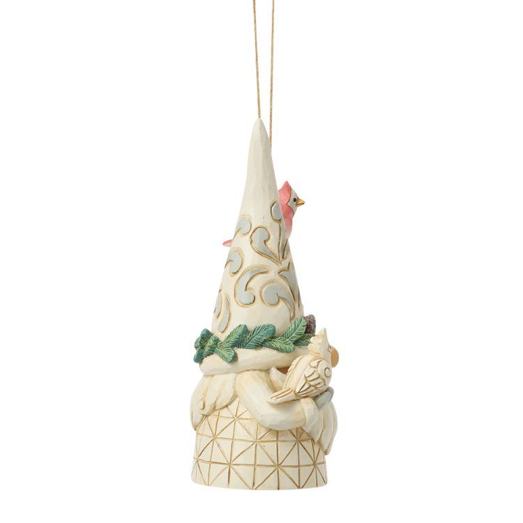 Crèmekleurig kabouterornament met een vogeltje, bladaccenten en kronkelende patronen.